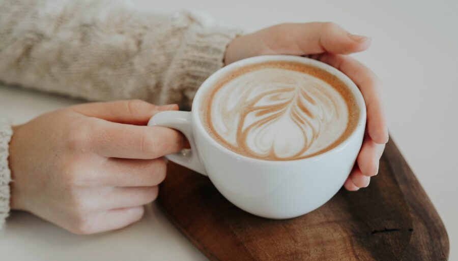 Picture of person holding coffee cup