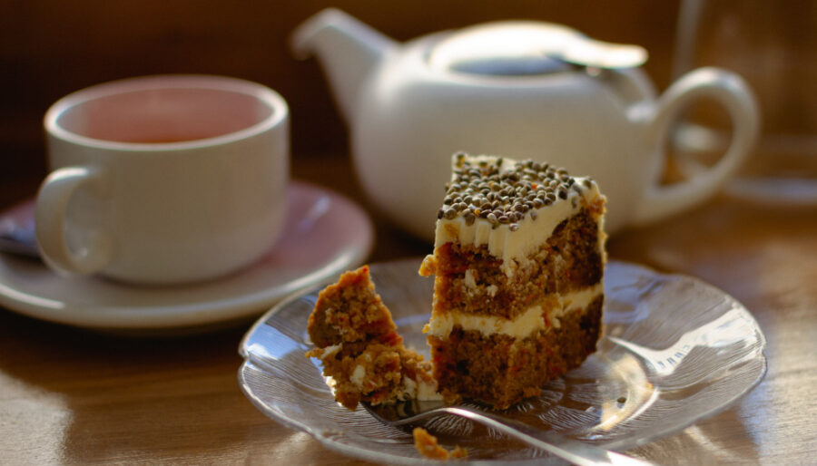 Photo of a slice of cake and a cup of tea