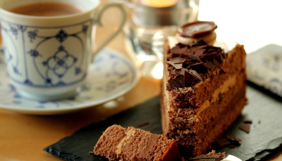 Image of a cup of tea and a slice of chocolate cake