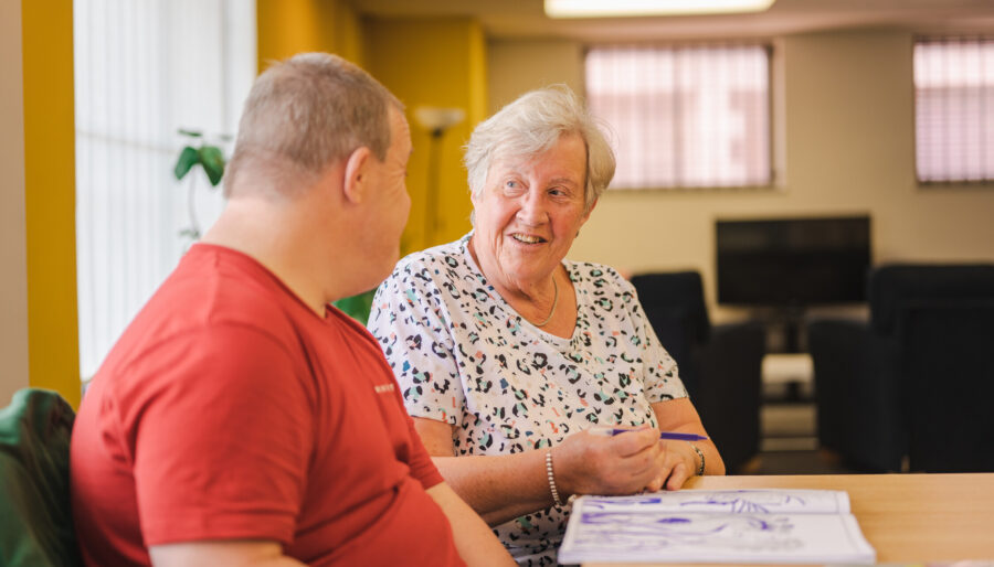 Picture of a mother and her son doing some colouring